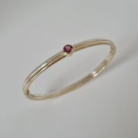 Armband van zilver en goud, aangevuld met roze toermalijn